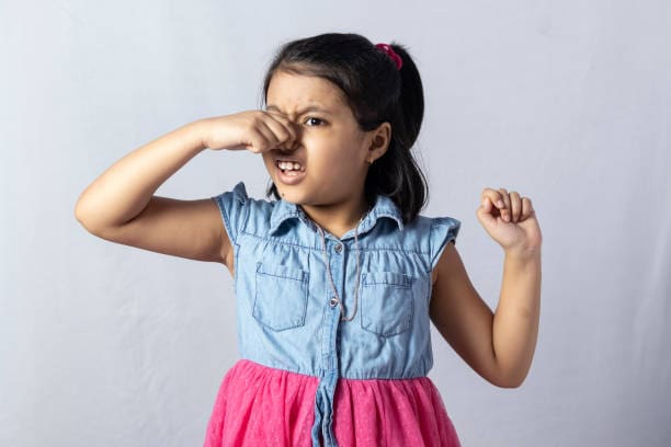 Girl Holding Her Nose