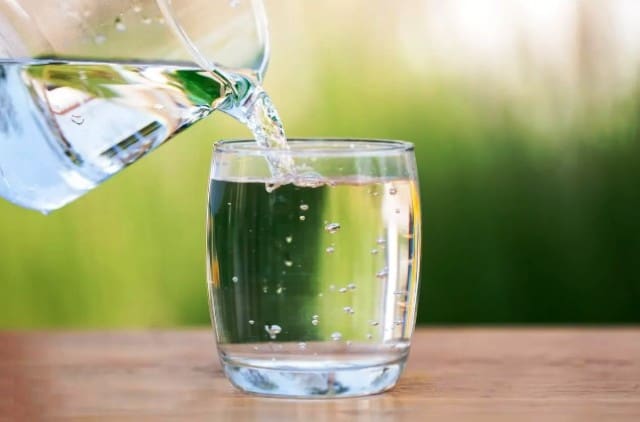 Glass of Water being Poured