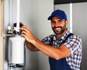 plumber installing a filter